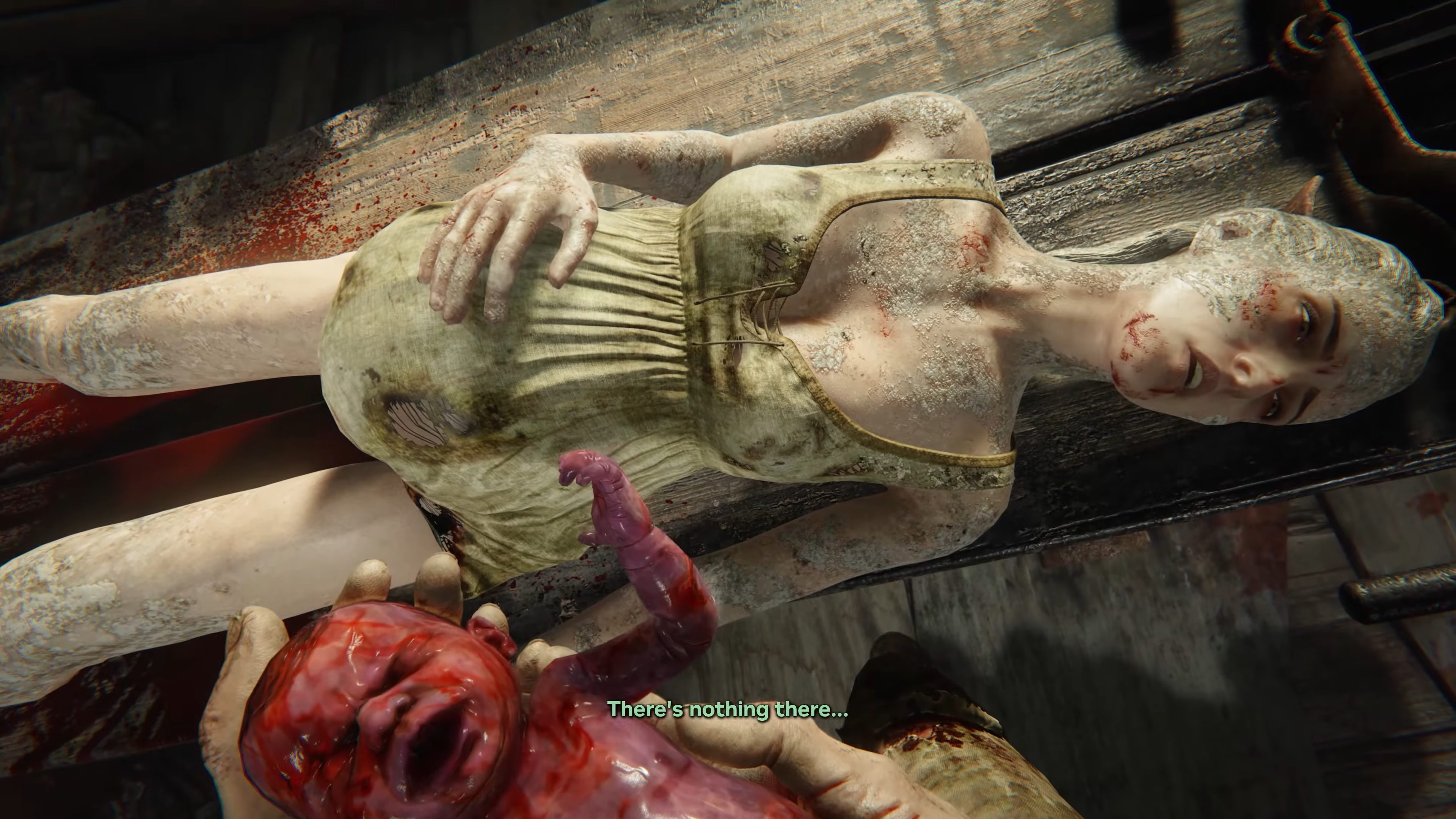 A pregnant woman covered in sandy dirt and wearing a ragged blouse lays on a plank of wood. There's a pained but vacant look on her face and her hand rests on her expanded belly. In the foreground, two hands hold a newborn baby covered in blood. An onscreen caption reads "There's nothing there..."
